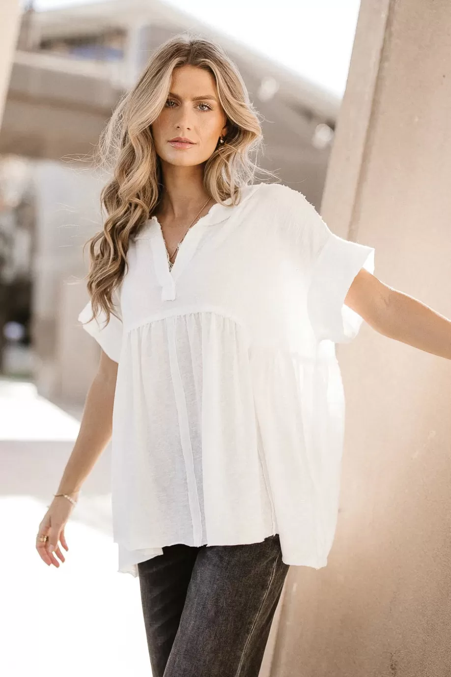 Shop Niki Exposed Seam Top in TOPS